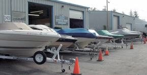 Covered boats waiting for service